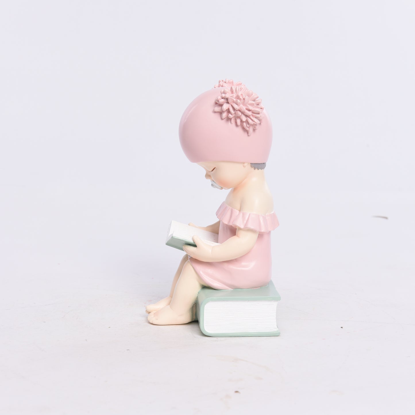 Pink baby statue, baby decoration with book, modern decoration, baby figure made of resin